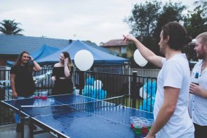 Friends Playing Ping Pong with Balloon